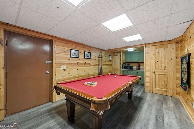 recreation room with pool table, wooden walls, and hardwood / wood-style floors