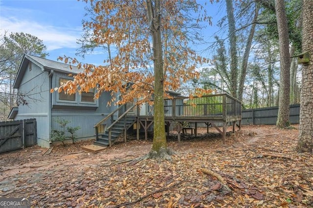 back of property featuring a wooden deck