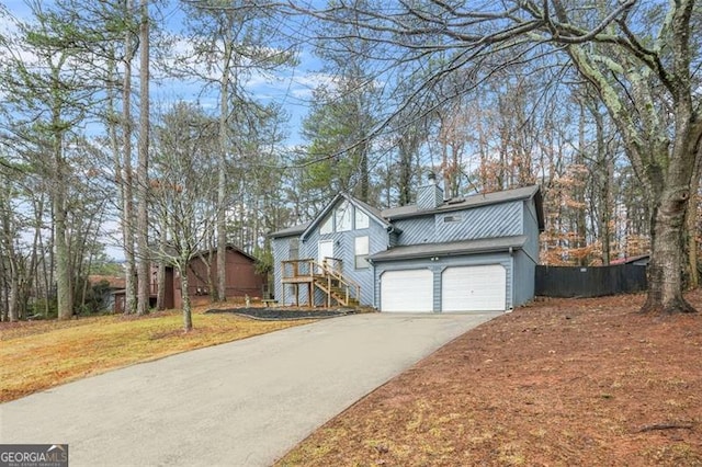 view of front of property featuring a garage and a front yard