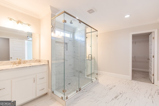 bathroom featuring crown molding, vanity, and a shower with shower door