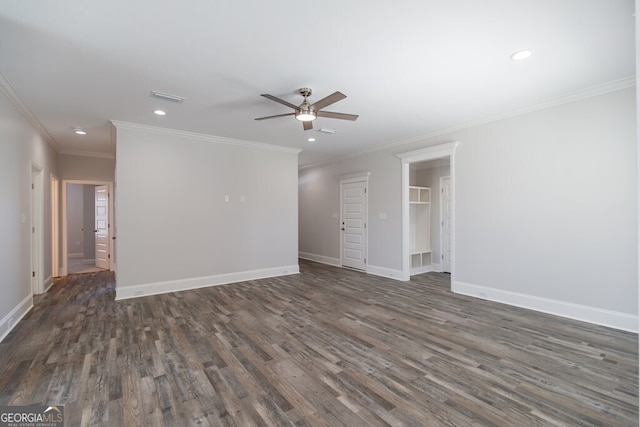 spare room with ornamental molding, dark wood-type flooring, and ceiling fan