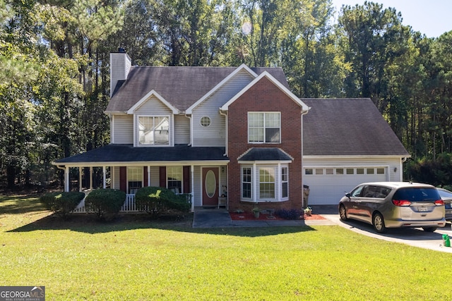 view of front of property featuring a porch, a garage, and a front lawn