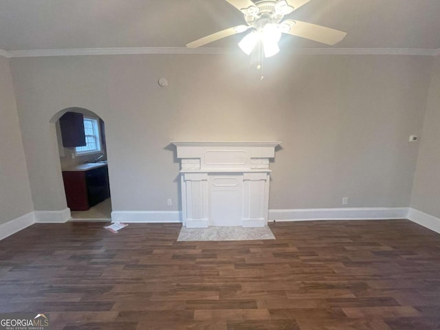 unfurnished living room with ceiling fan, ornamental molding, and dark hardwood / wood-style floors