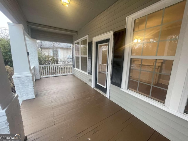 wooden terrace with a porch