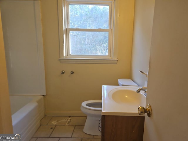 bathroom with tile patterned flooring, vanity, and toilet