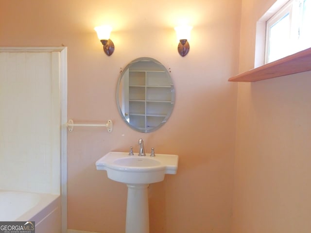 bathroom featuring a tub to relax in