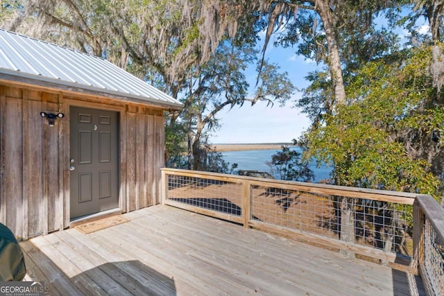 deck featuring a water view