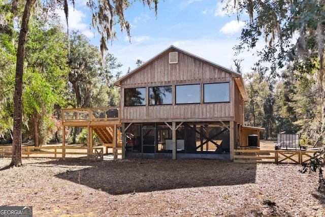 rear view of property featuring central air condition unit