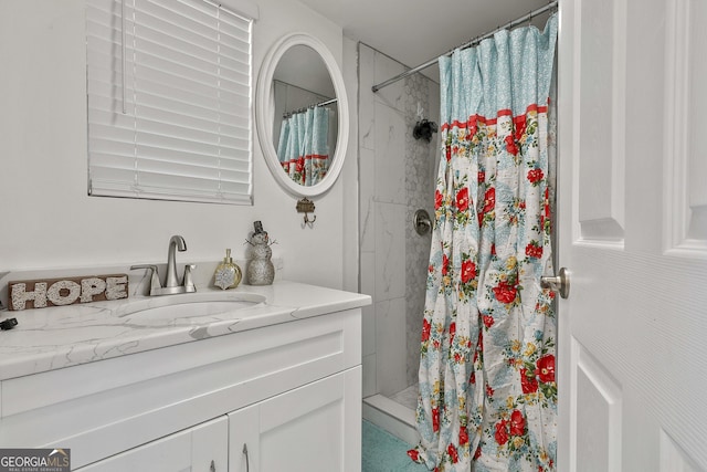 bathroom with vanity and walk in shower