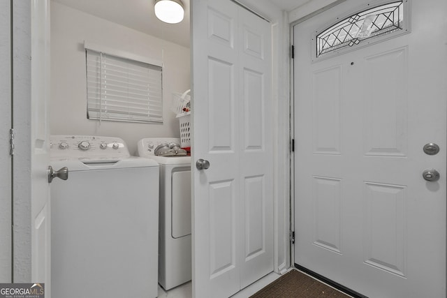 laundry area featuring washing machine and clothes dryer