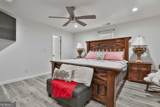 bedroom with ceiling fan and light wood-type flooring