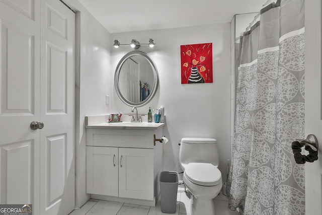 bathroom featuring vanity, toilet, and a shower with shower curtain