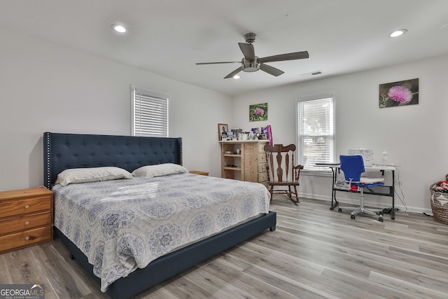 bedroom with hardwood / wood-style floors and ceiling fan