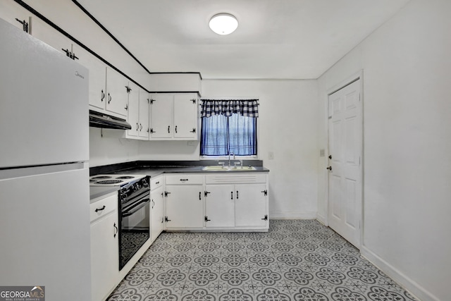 kitchen with sink, black range with electric cooktop, white fridge, and white cabinets