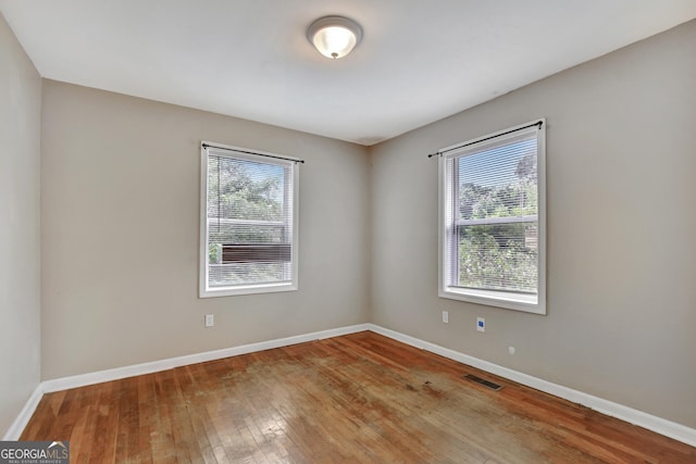 empty room with light hardwood / wood-style floors