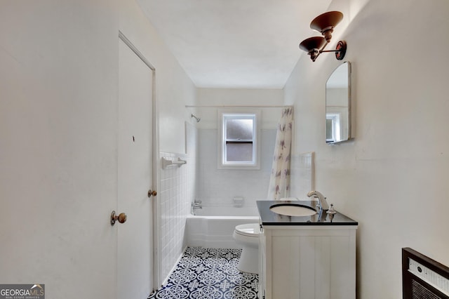 full bathroom with shower / bathtub combination with curtain, vanity, toilet, and tile patterned flooring