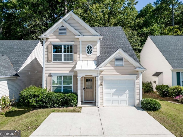 view of front facade featuring a garage and a front yard