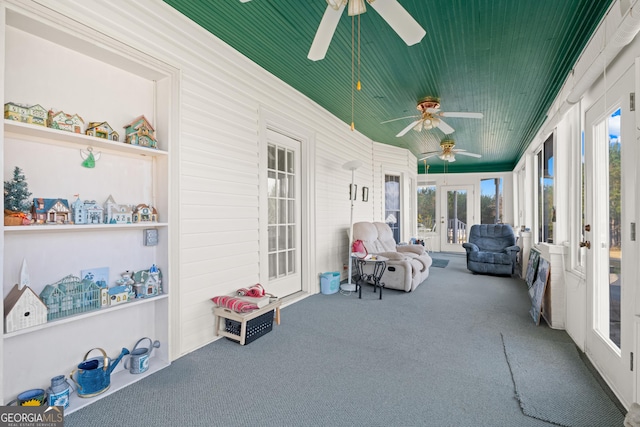 sunroom featuring french doors and ceiling fan