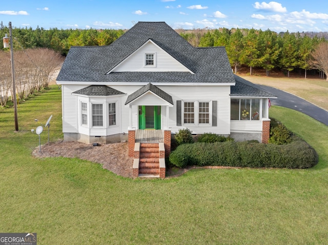 view of front of property with a front lawn