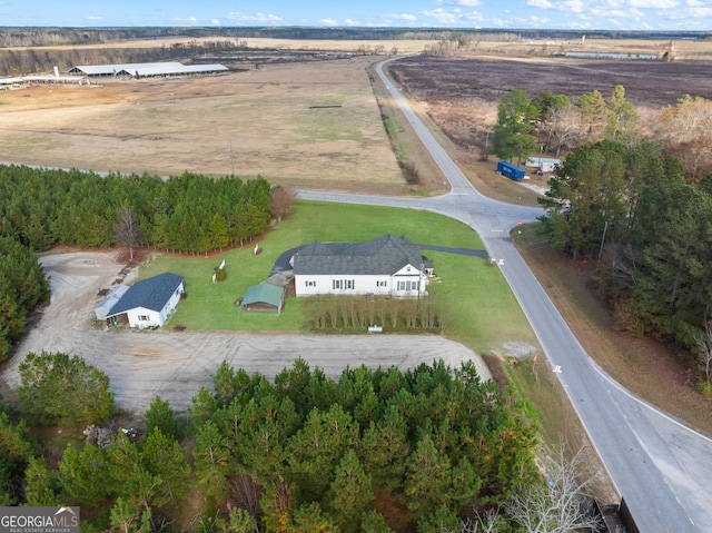 birds eye view of property featuring a rural view