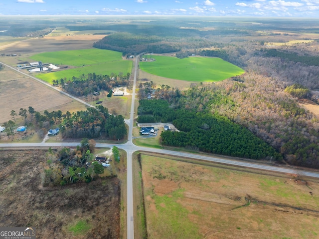 birds eye view of property with a rural view