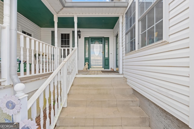 property entrance with covered porch