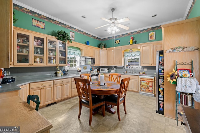 kitchen featuring dishwasher, sink, ceiling fan, crown molding, and light brown cabinets