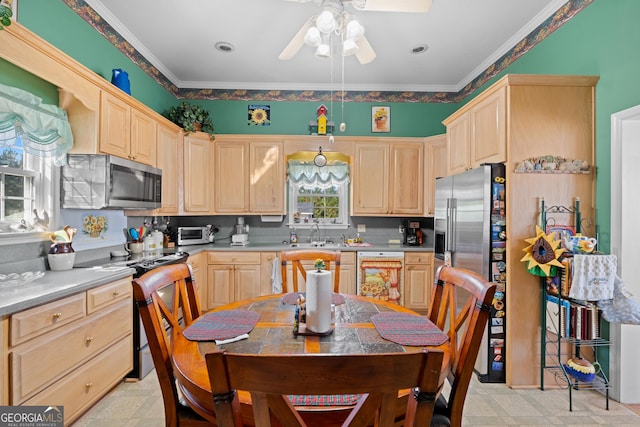 kitchen featuring stainless steel appliances, ornamental molding, sink, and light brown cabinetry