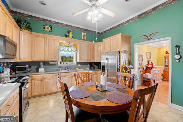 kitchen featuring appliances with stainless steel finishes, light brown cabinetry, sink, ornamental molding, and ceiling fan