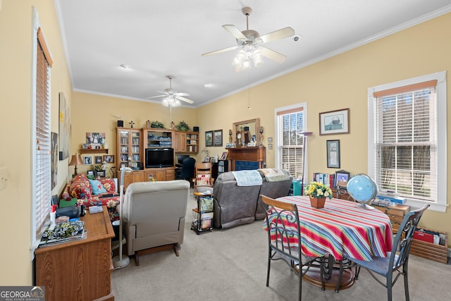 carpeted living room featuring crown molding and ceiling fan