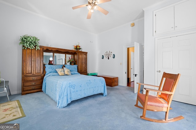 bedroom with ornamental molding, light colored carpet, and ceiling fan