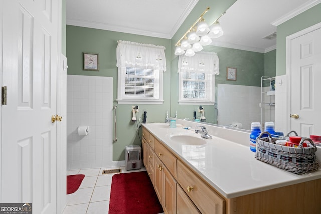 bathroom with vanity, crown molding, tile patterned floors, and a shower