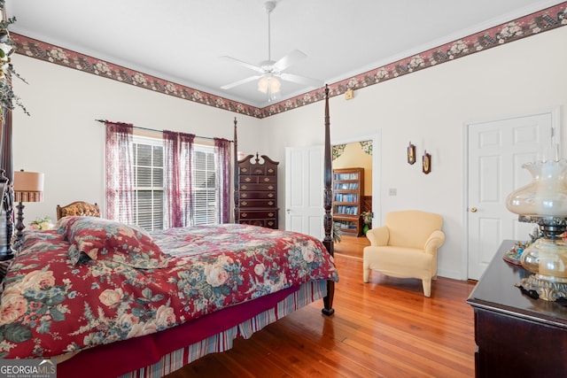 bedroom with hardwood / wood-style flooring and ceiling fan