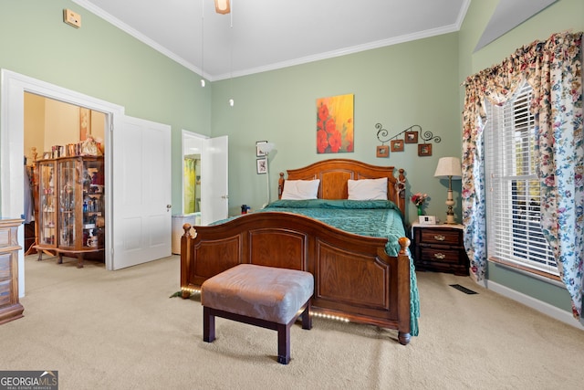 carpeted bedroom with crown molding and ceiling fan