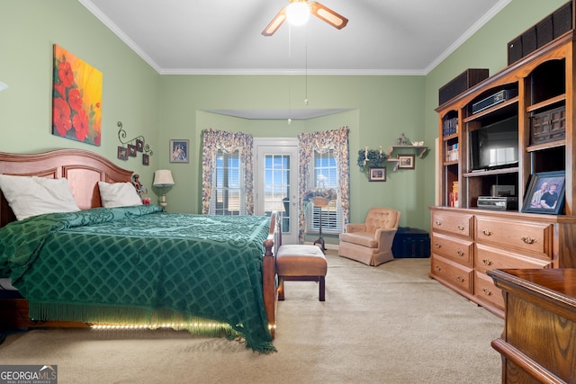 bedroom featuring ornamental molding, light carpet, and ceiling fan