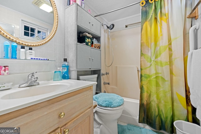 full bathroom with crown molding, vanity, toilet, and shower / bath combo with shower curtain