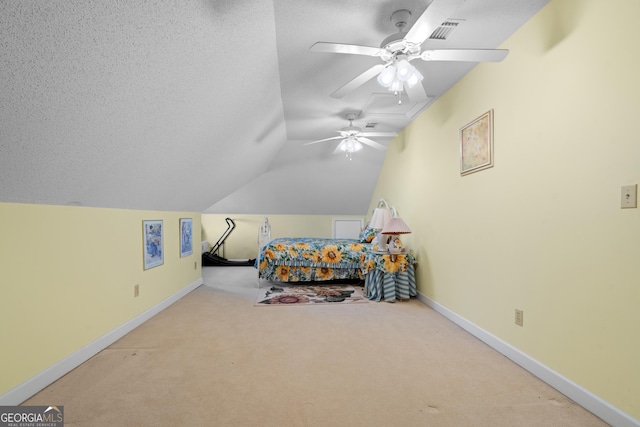 bedroom with ceiling fan, lofted ceiling, light carpet, and a textured ceiling