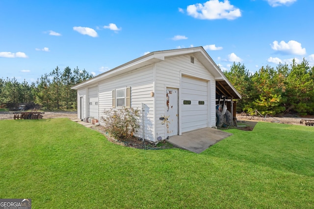 garage with a yard