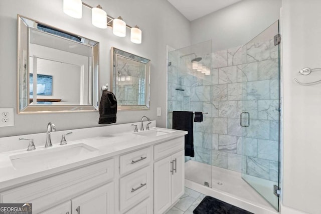 bathroom featuring vanity and a shower with door