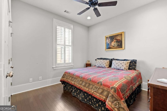 bedroom with dark wood-type flooring and ceiling fan