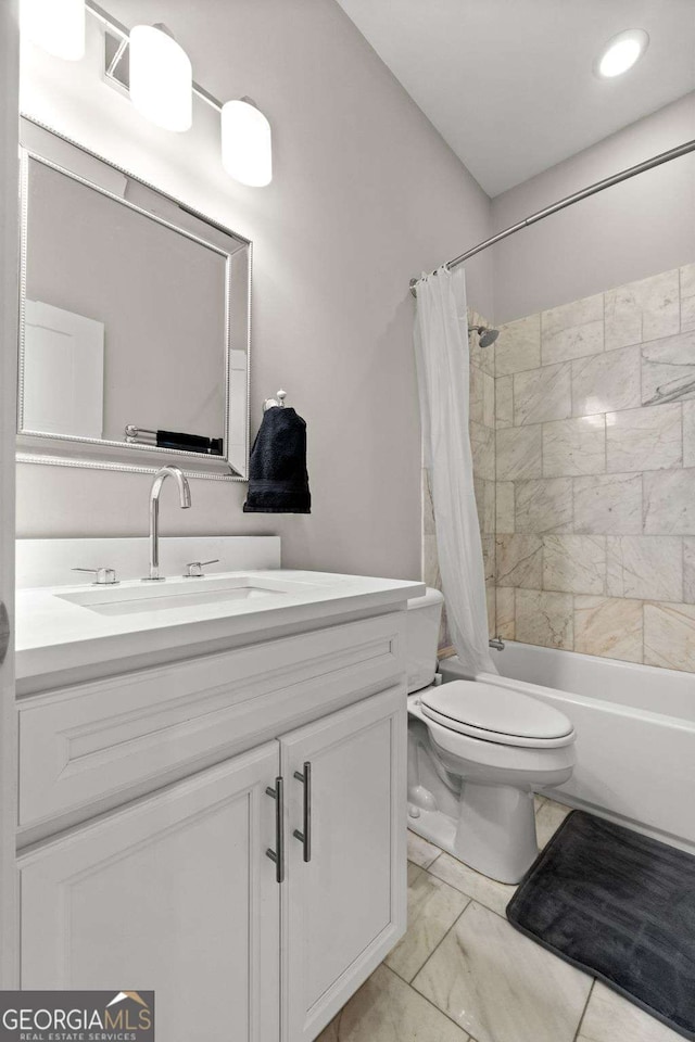 full bathroom with shower / tub combo, vanity, and toilet