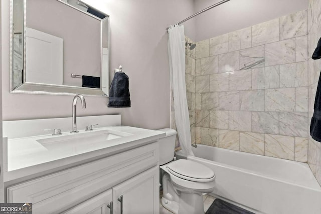 full bathroom with shower / bath combo, vanity, and toilet