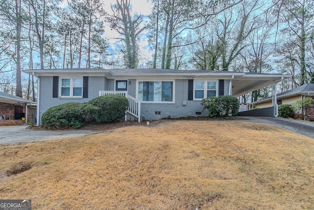 single story home with a carport and a front yard