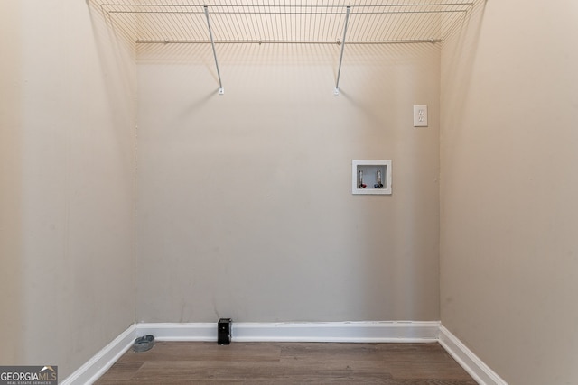 clothes washing area featuring washer hookup and hardwood / wood-style floors