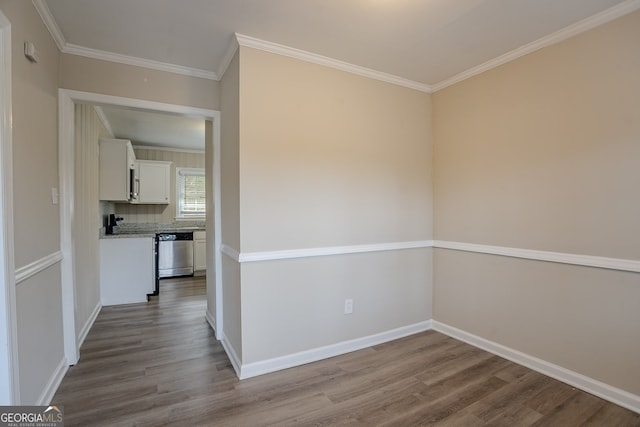 interior space featuring hardwood / wood-style flooring and ornamental molding