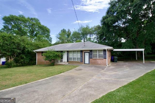 view of front of property featuring a carport and a front lawn