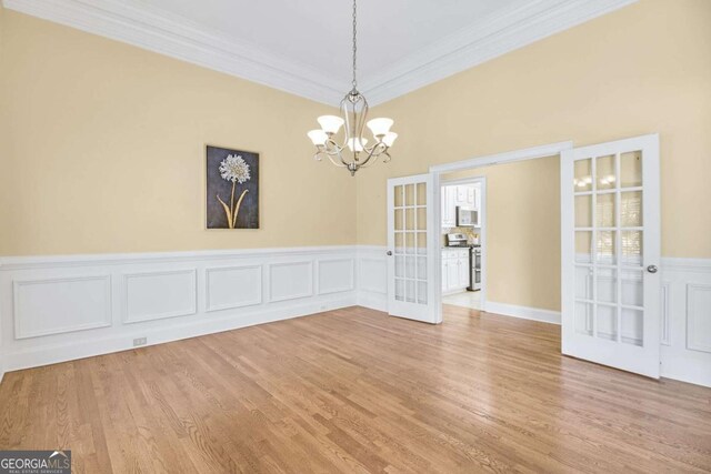 entrance foyer with crown molding, hardwood / wood-style floors, and a tray ceiling