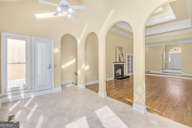 empty room featuring hardwood / wood-style flooring, crown molding, and a tray ceiling