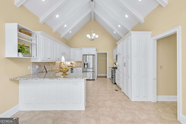 spare room featuring a high ceiling, ornamental molding, ceiling fan, and light hardwood / wood-style flooring