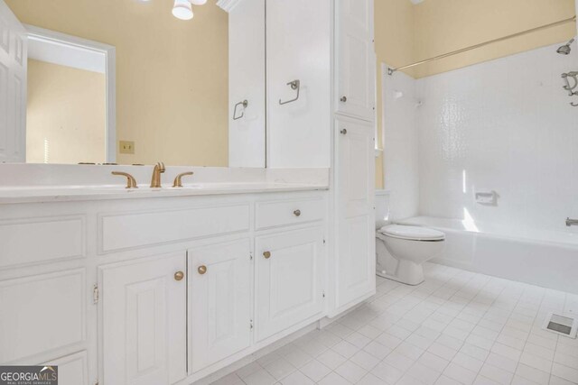 kitchen with tasteful backsplash, white cabinetry, sink, stainless steel dishwasher, and light stone countertops